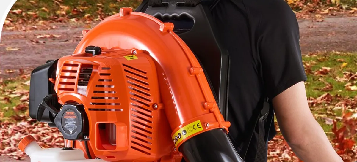Blowing clippings into tidy piles with the backpack leaf blower